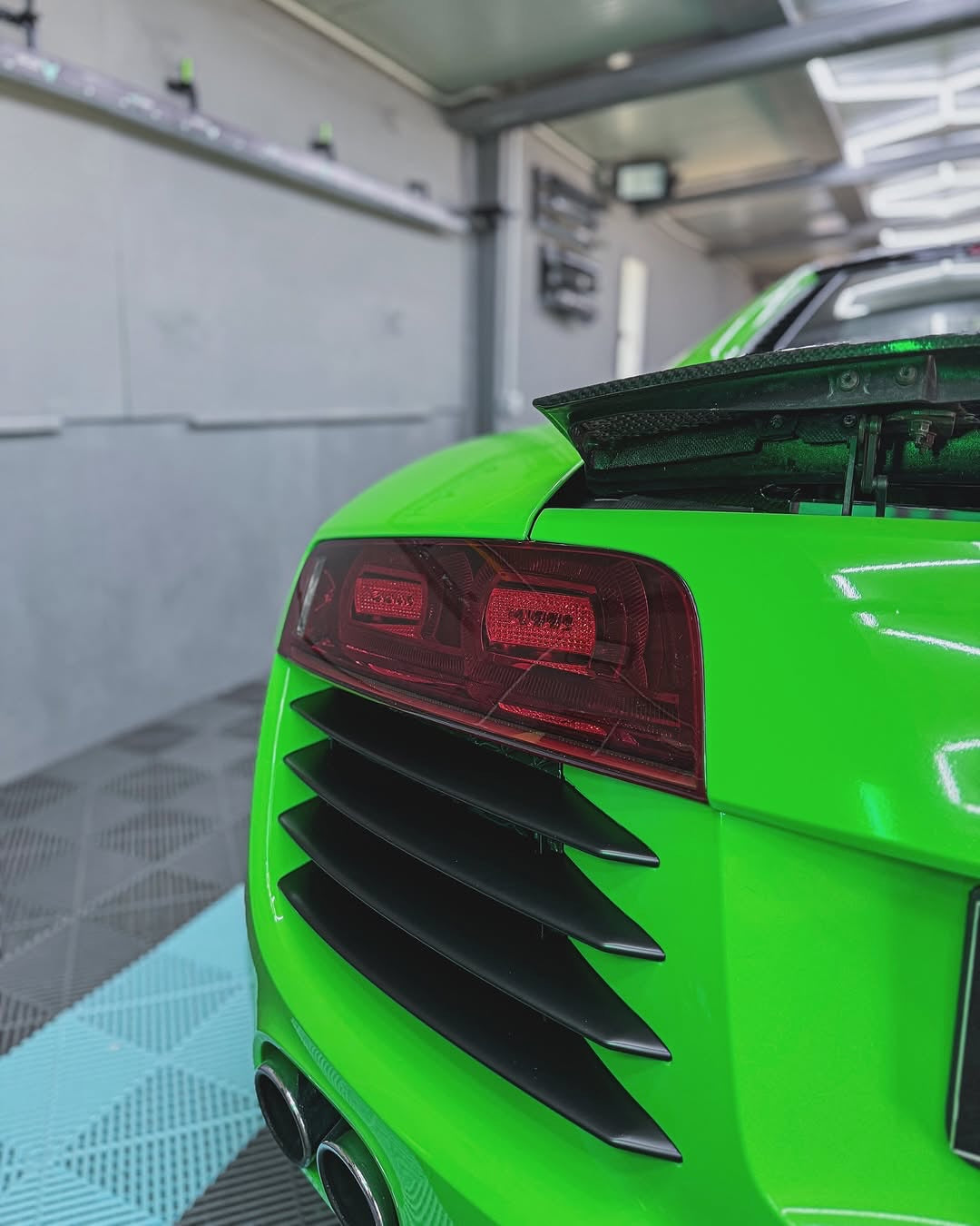 Close-up of an Oracal Gloss Lawn Green wrap on a car's rear end