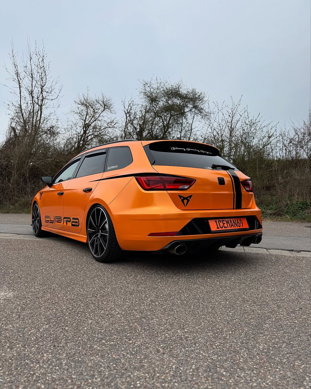 Oracal Gloss Mandarin Metallic car on a road with trees