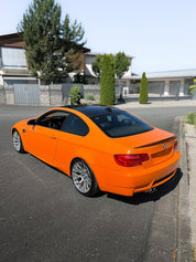 Oracal Gloss Municipal Orange on a  BMW car parked on a residential street