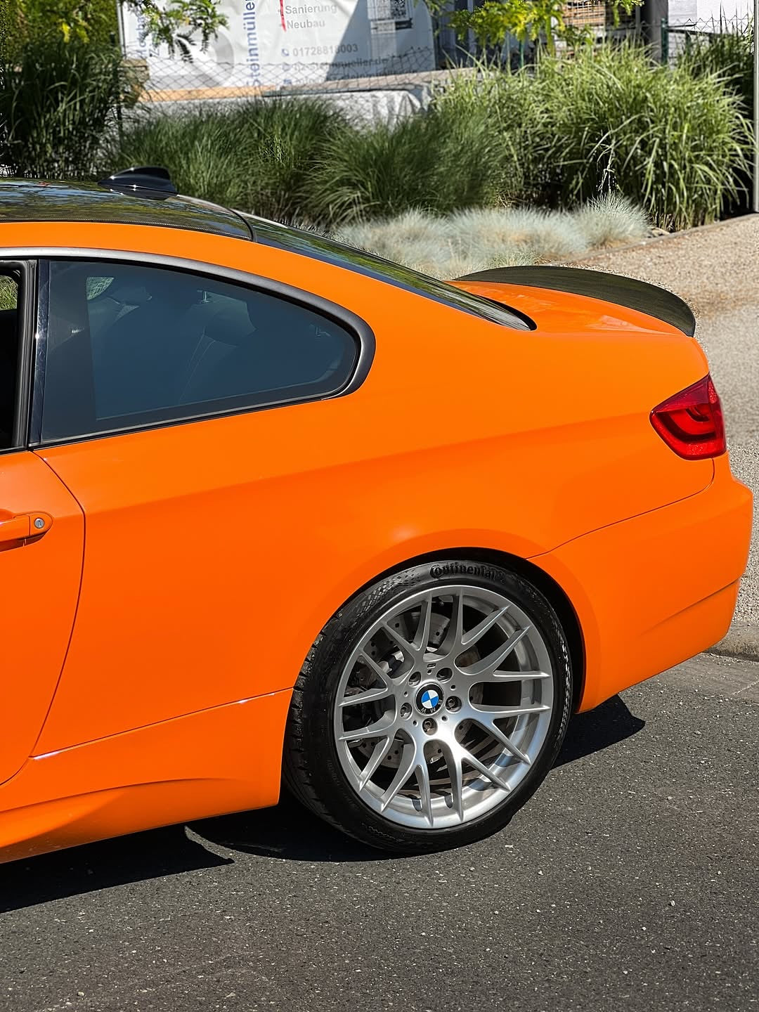 Oracal Gloss Municipal Orange on a  BMW car parked on a street
