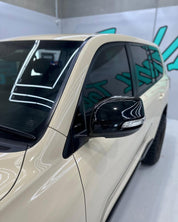 Close-up of an Oracal Gloss Papyrus car's side mirror and door 