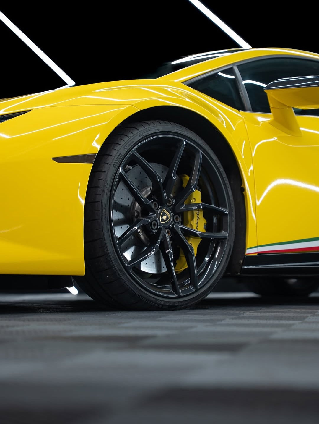 Lamborghini with black wheels and Oracal Gloss Traffic Yellow installed