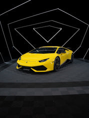 Oracal Gloss Traffic Yellow on Lamborghini with a black checkered floor with geometric light design