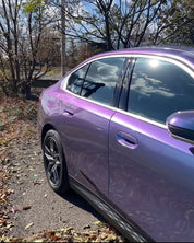 Oracal Gloss Turquoise Lavender car parked on a gravel road with trees and sky
