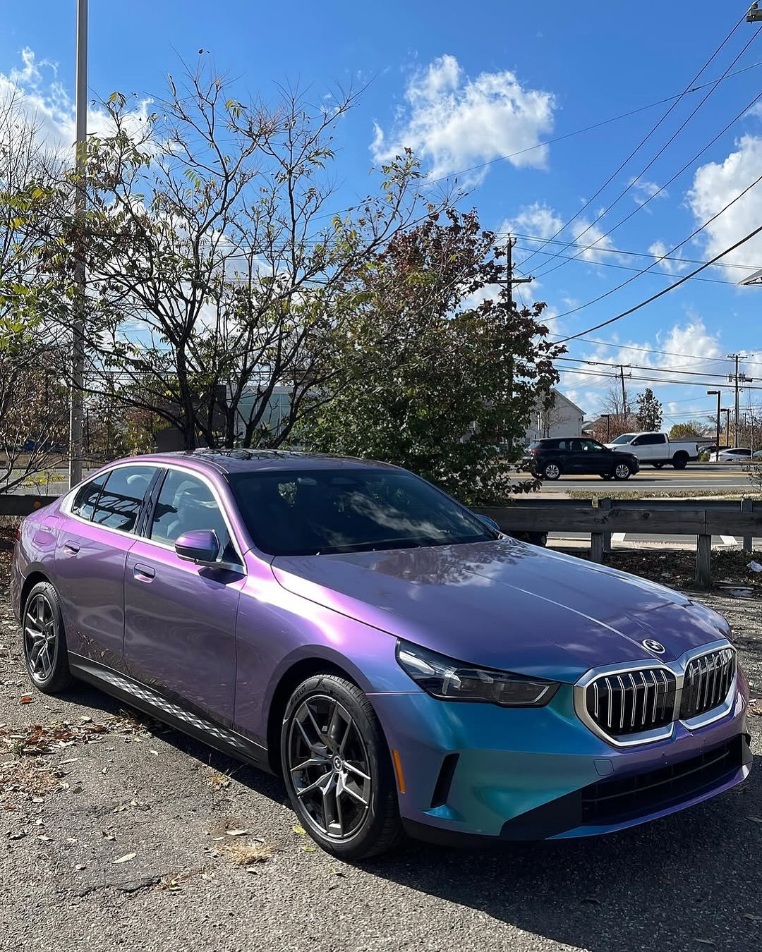 Oracal Gloss Turquoise Lavender BMW car on a road with trees and power lines