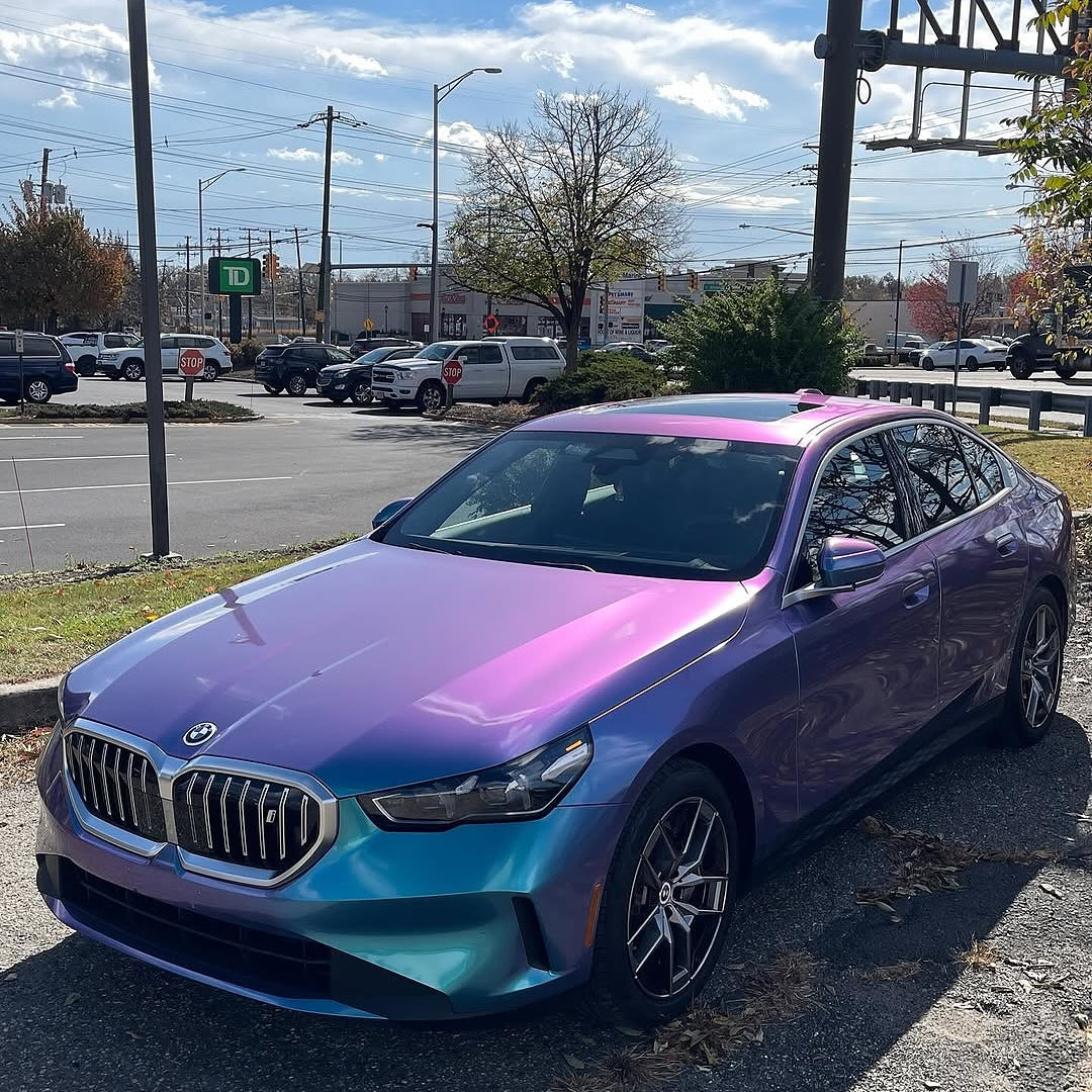 Oracal Gloss Turquoise Lavender car parked on a street in a cityscape