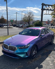 Oracal Gloss Turquoise Lavender car parked on a street in a cityscape