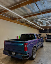 Rear view of Oracal Gloss Ultramarine Violet  Chevrolet truck parked inside a warehouse