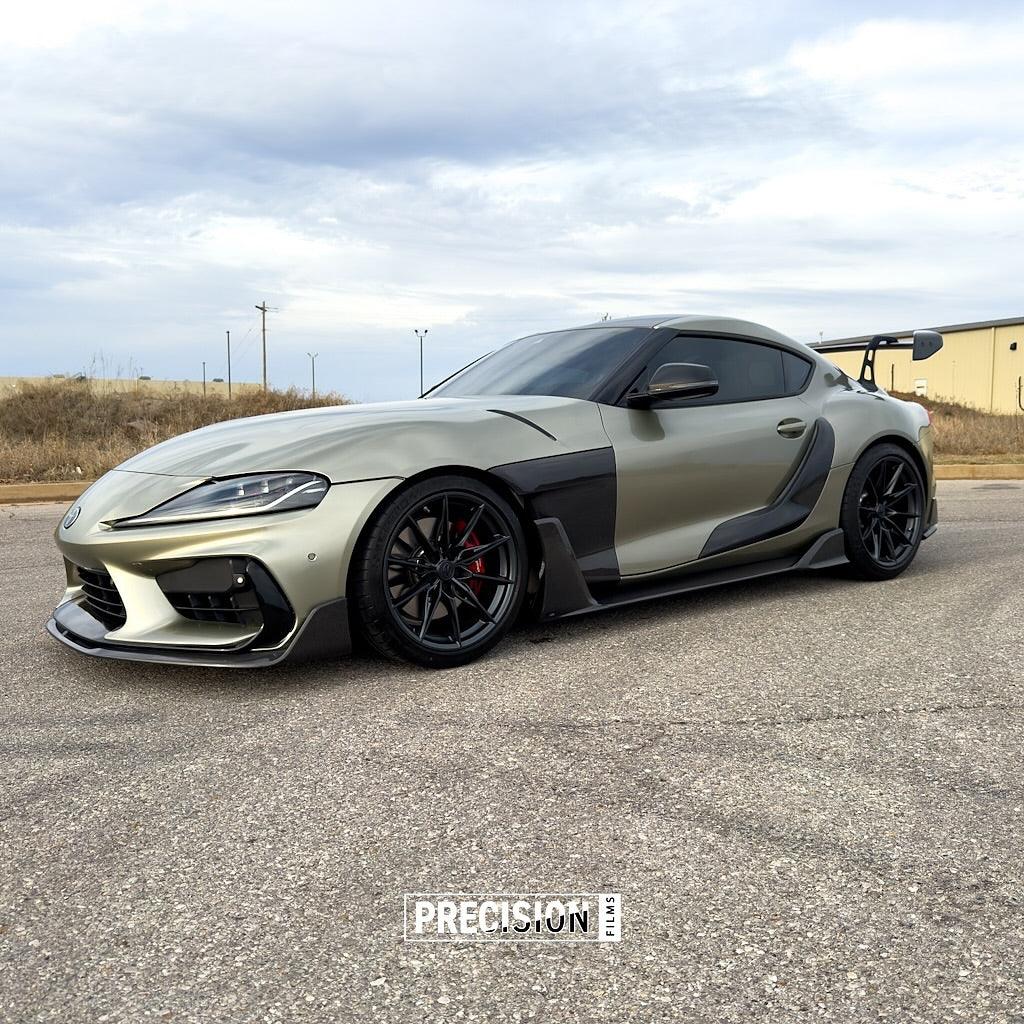 A car parked on a road with Oracal Gloss Zinc Metallic installed