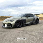 A car parked on a road with Oracal Gloss Zinc Metallic installed
