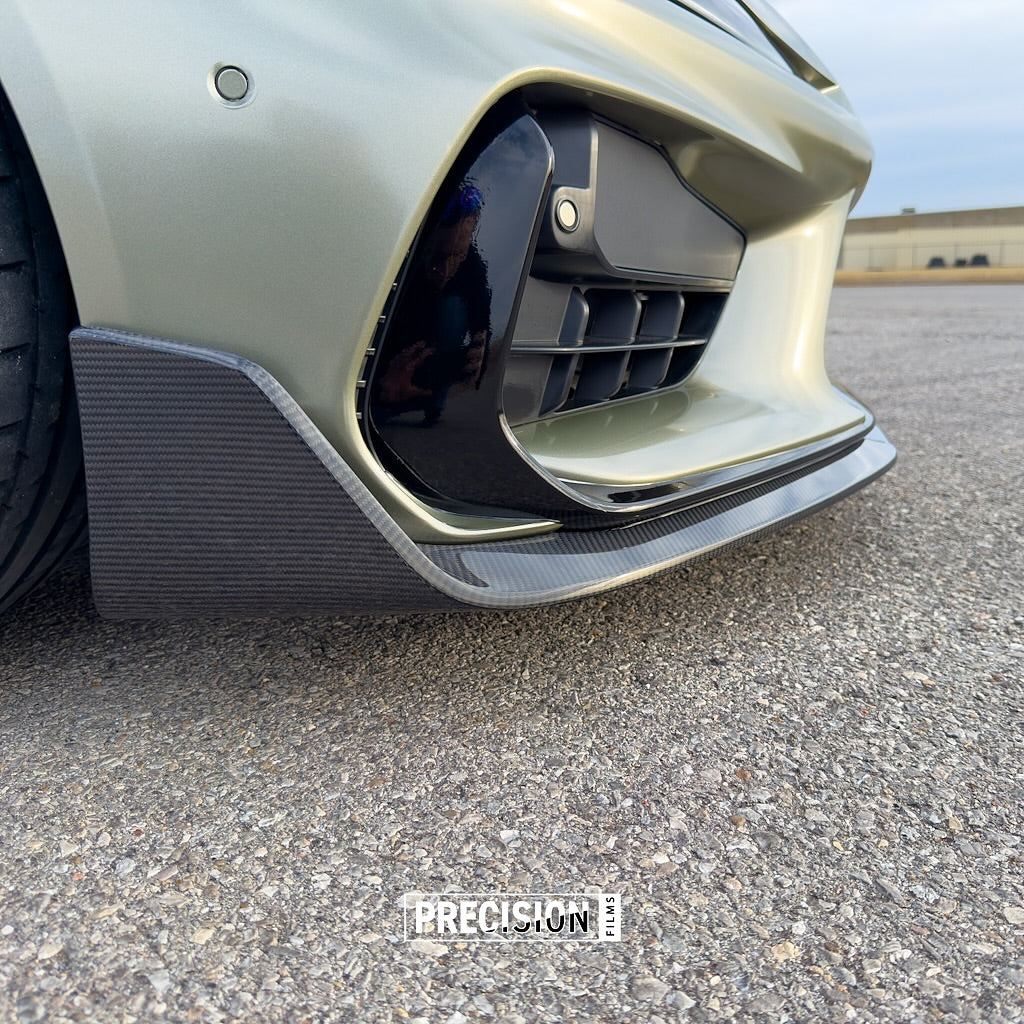 Close-up of a car's front bumper with Oracal Gloss Zinc Metallic installed