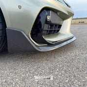 Close-up of a car's front bumper with Oracal Gloss Zinc Metallic installed