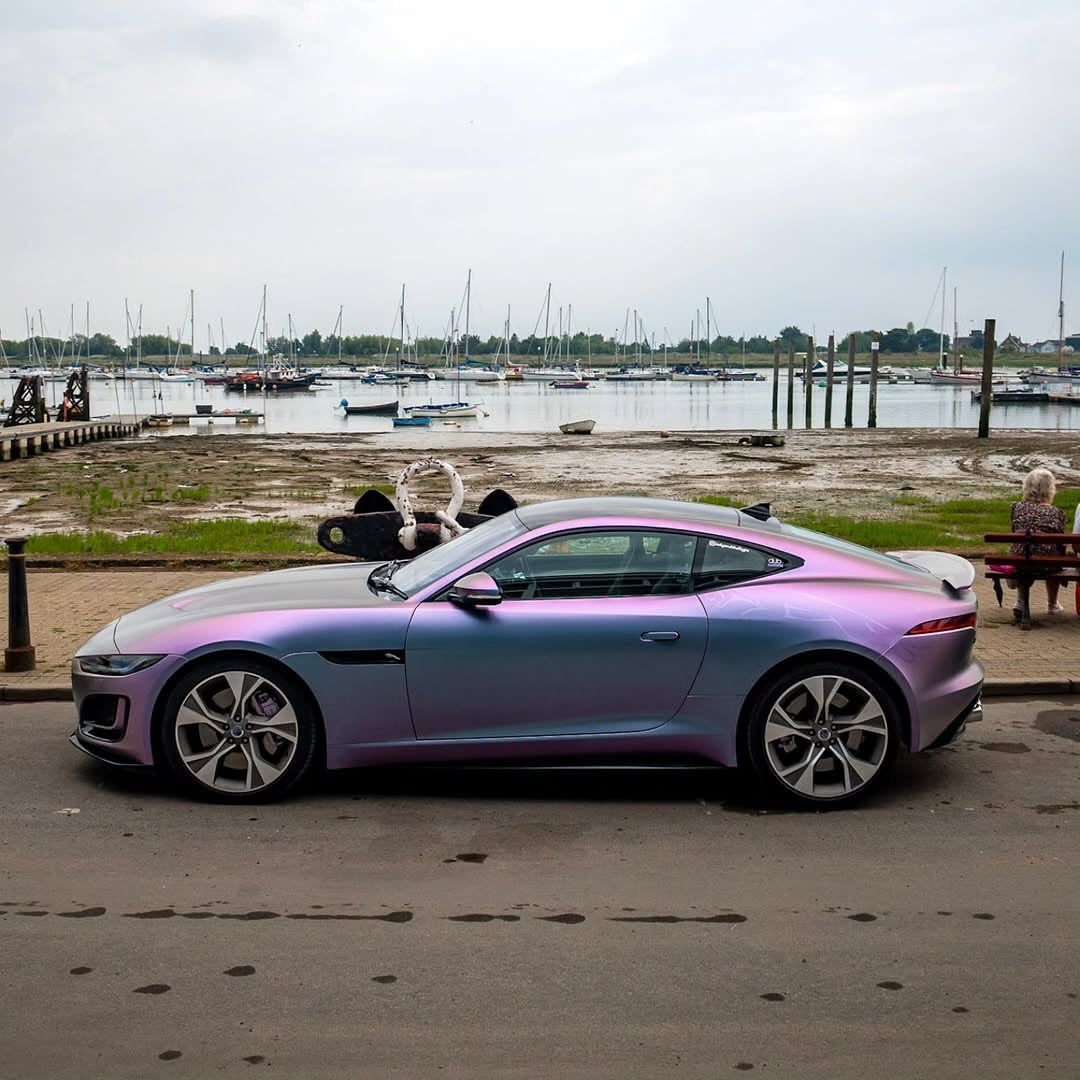 Oracal Matte Amethyst on a luxury car, parked by a marina with boats and docks