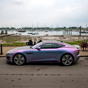 Oracal Matte Amethyst on a luxury car, parked by a marina with boats and docks