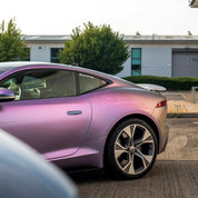 Oracal Matte Amethyst installed on the sports car, parked on a driveway with a house