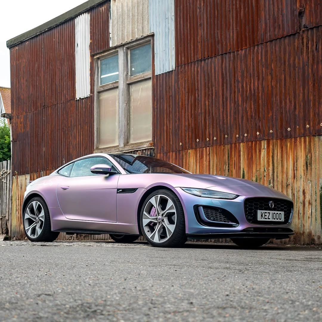 Oracal Matte Amethyst on a sports car, parked in front of a rustic building