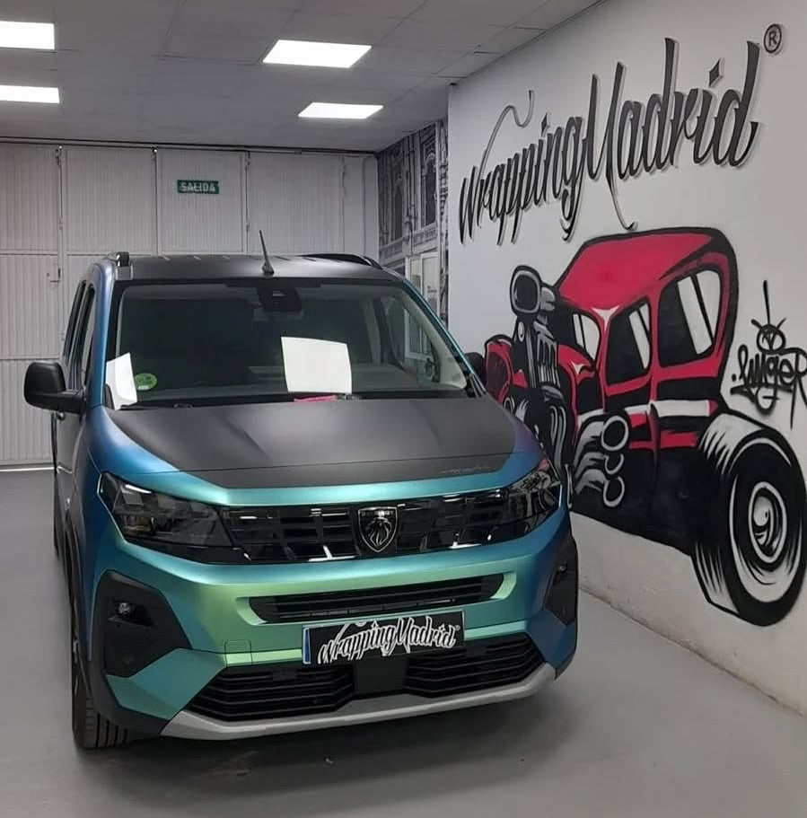 A car parked in a garage with Oracal Matte Aquamarine installed