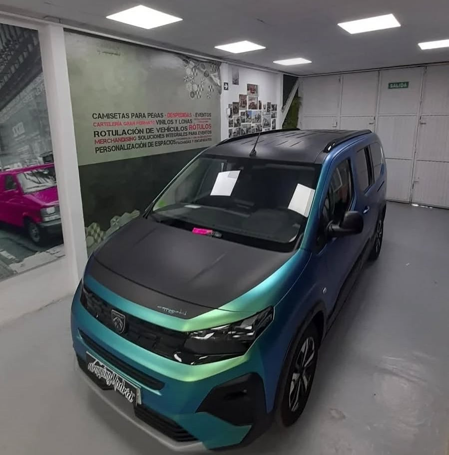 Car inside a showroom with Oracal Matte Aquamarine installed