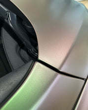 Close-up of a metallic car surface with Oracal Matte Avocado installed