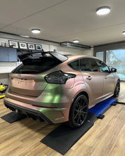 Oracal Matte Avocado car on a lift in a garage 