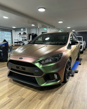 Oracal Matte Avocado car on display in a showroom with wooden flooring
