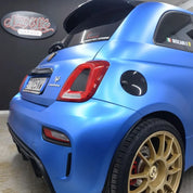 Oracal Matte Azure Blue Metallic car with gold wheels in a garage
