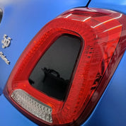 Close-up of a car tail light with Oracal Matte Azure Blue Metallic wrap installed