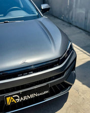 Car hood with Oracal Matte Charcoal Metallic wrap installed