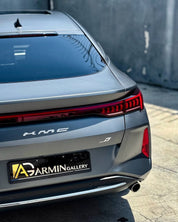 Back view of a car with Oracal Matte Charcoal Metallic wrap installed