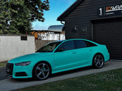 Oracal Matte Mint installed on Audi car parked in front of a building