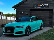Oracal Matte Mint installed on Audi car parked in front of a building