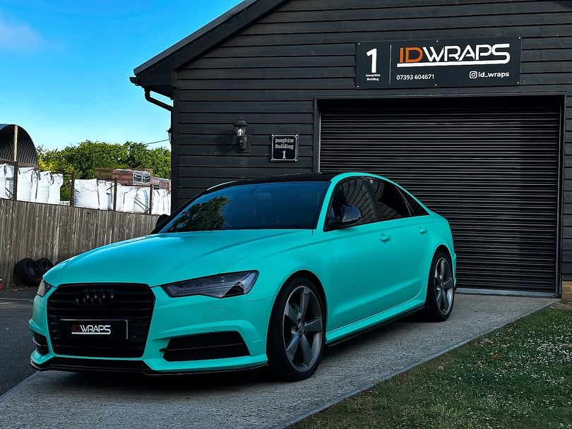 Oracal Matte Mint installed on Audi car parked in front of a building