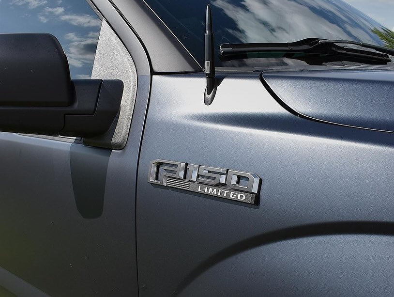 Close-up of an Oracal Matte Moonlight Metallic wrap installed on Ford door with 'Fusion Limited' badge on a metallic vehicle