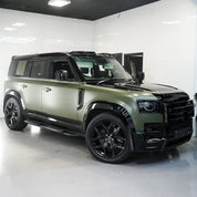 Oracal Matte Nato Olive installed on an SUV parked in a showroom