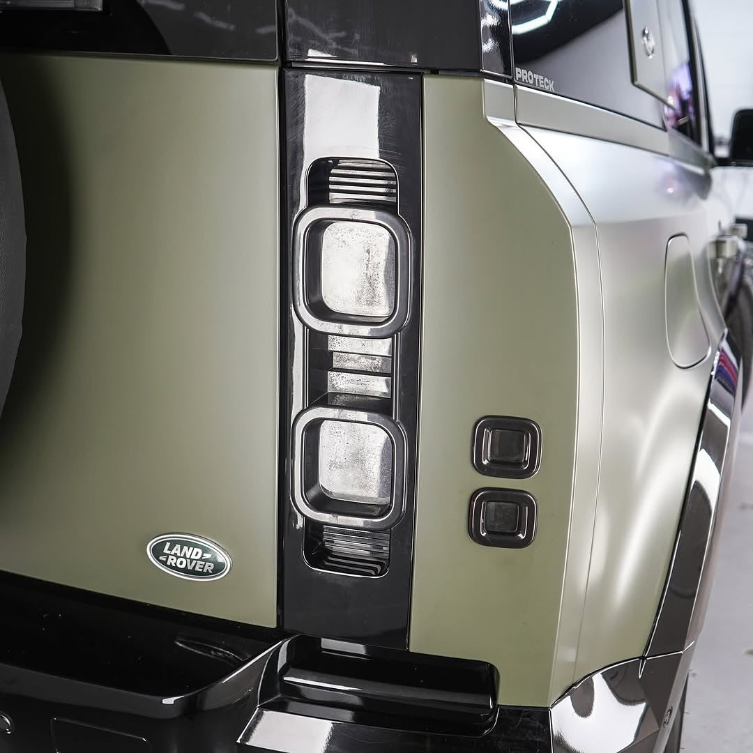 Close-up of a Range Rover vehicle headlight with Oracal Matte Nato Olive installed