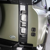 Close-up of a Range Rover vehicle headlight with Oracal Matte Nato Olive installed
