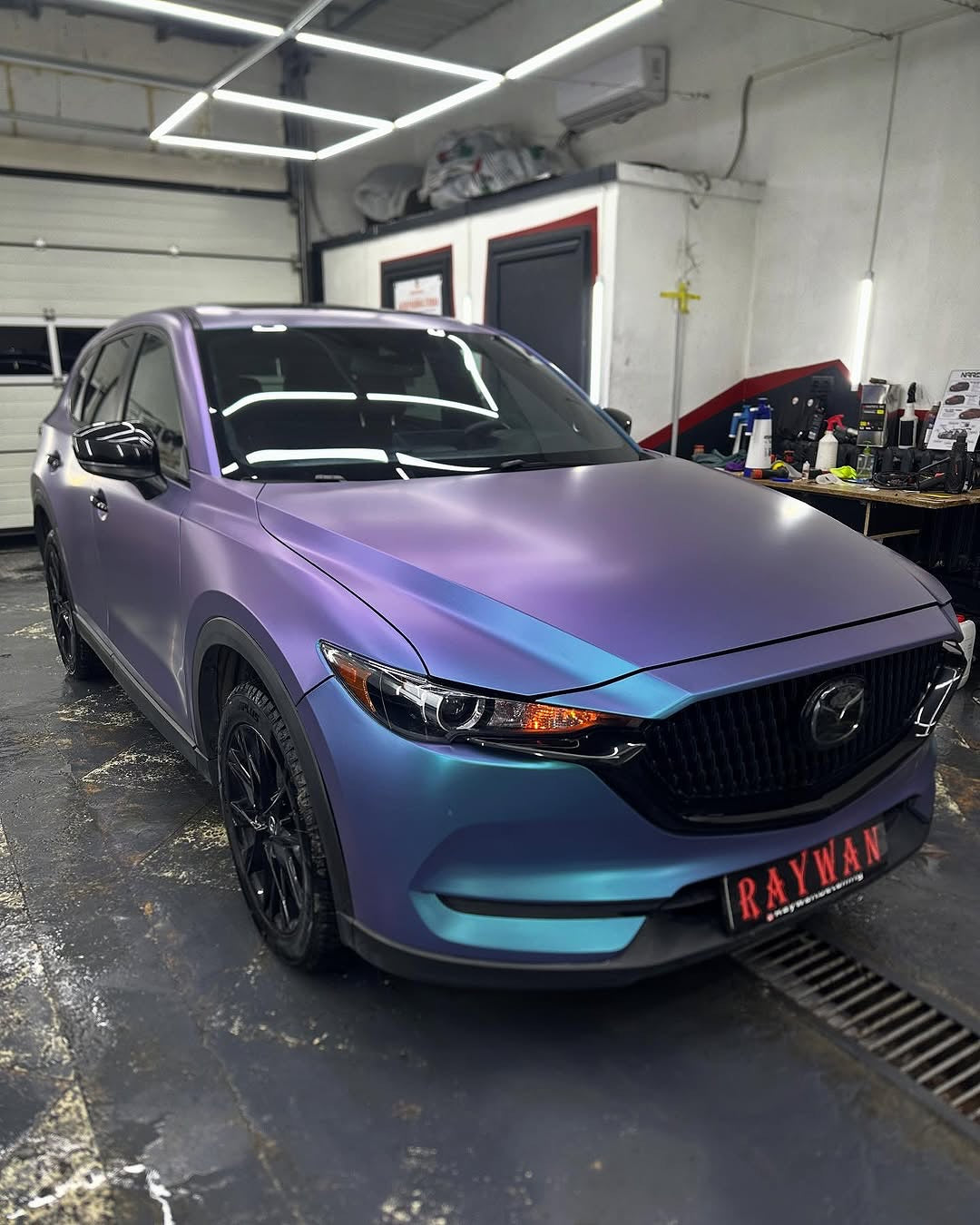 Oracal Matte Ultramarine Violet car parked in a garage