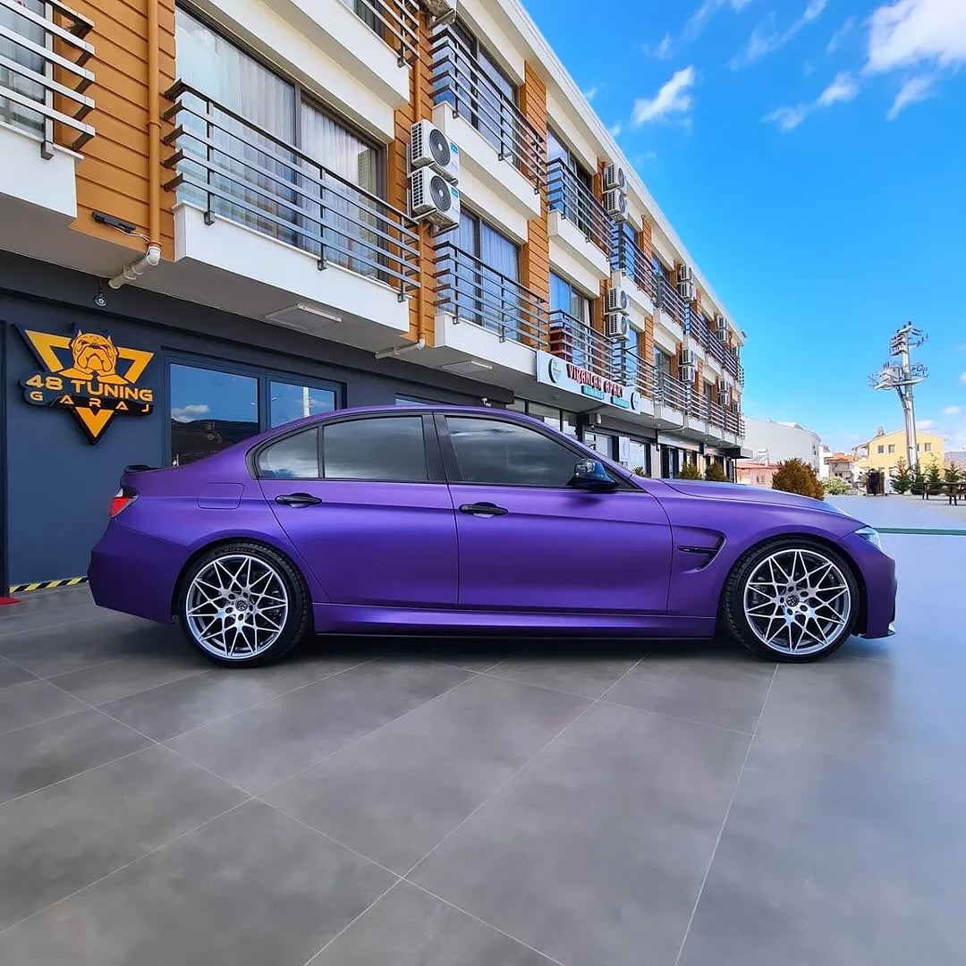 Oracal Matte Violet Metallic car parked in front of a building with a clear blue sky