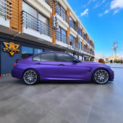 Oracal Matte Violet Metallic car parked in front of a building with a clear blue sky