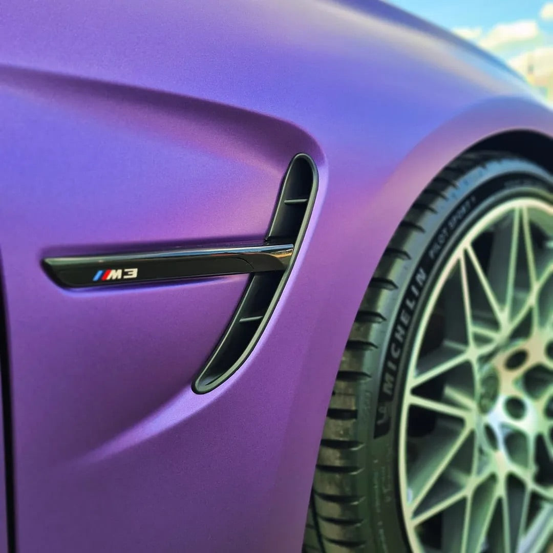 Close-up of a car with Oracal Matte Violet Metallic installed