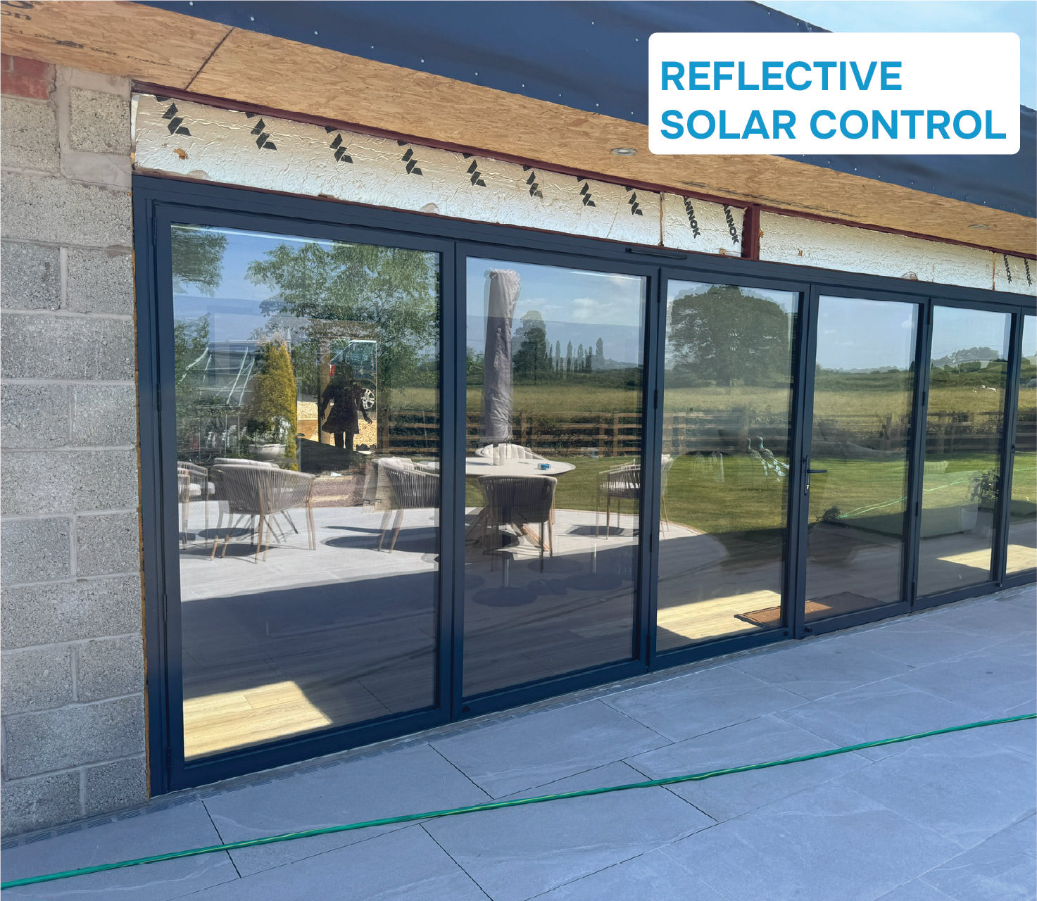 files/Reflective_solar_film_bifold_doors_e708bba3-4518-4693-bd8c-96722926f144.jpg