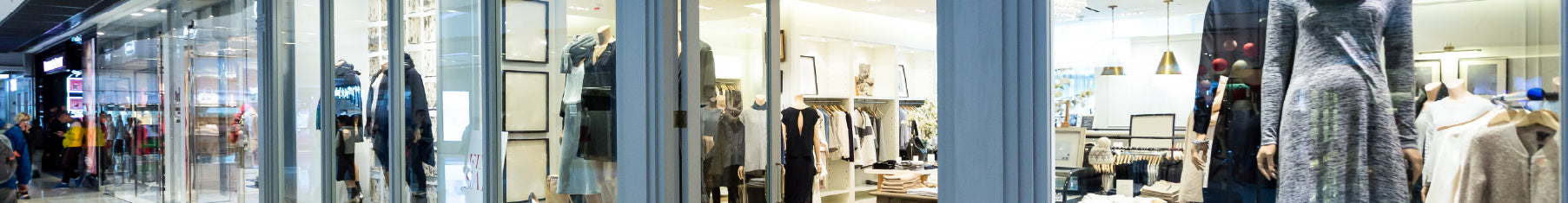 UV window film on a fashion store with mannequins and clothing