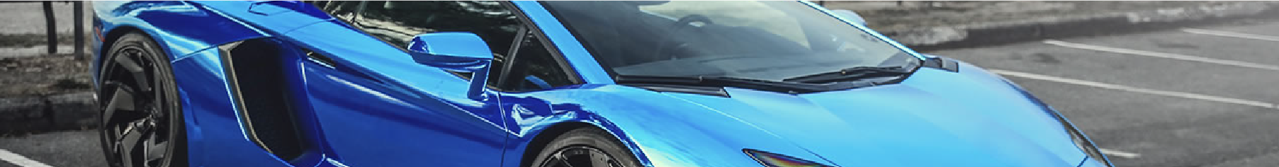 Blue chrome car wrap installed on a Lambo in a car park