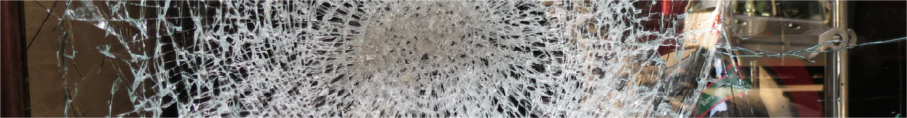 Panorama of a cracked window with anti shatter window film installed