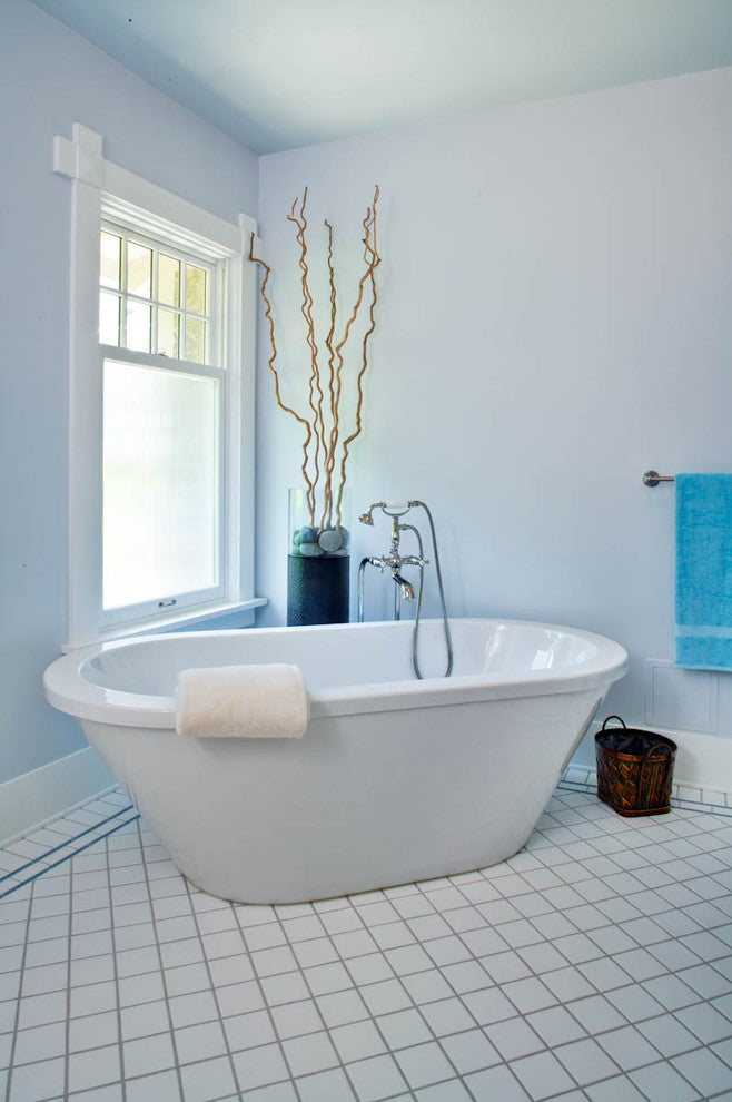 White Frost window film fitted to the lower section of a bathroom window beside a freestanding bath.