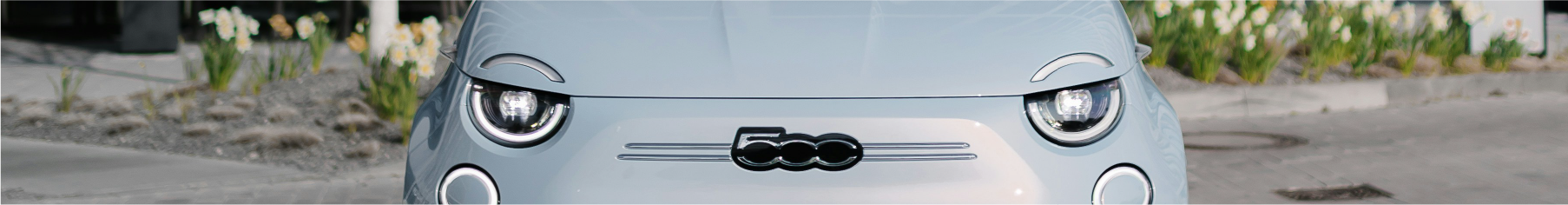 Cropped image of a Fiat on a road with Fiat window tints installed