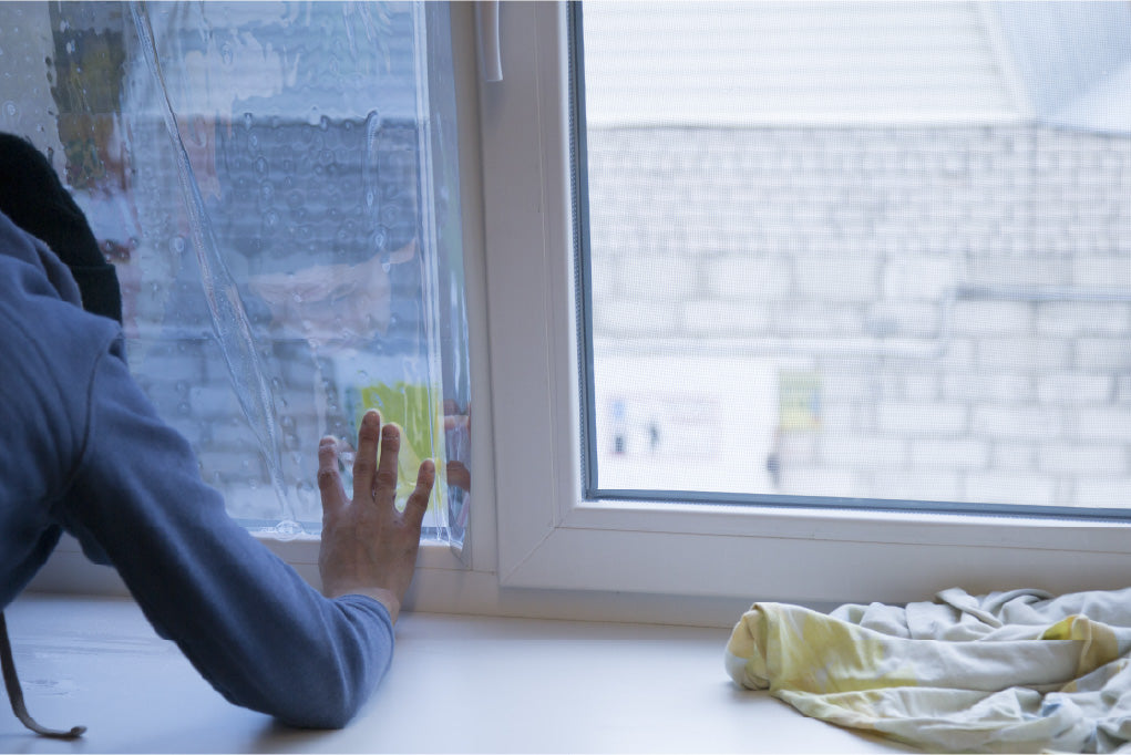 Evowrap fitter carrying out window film installation