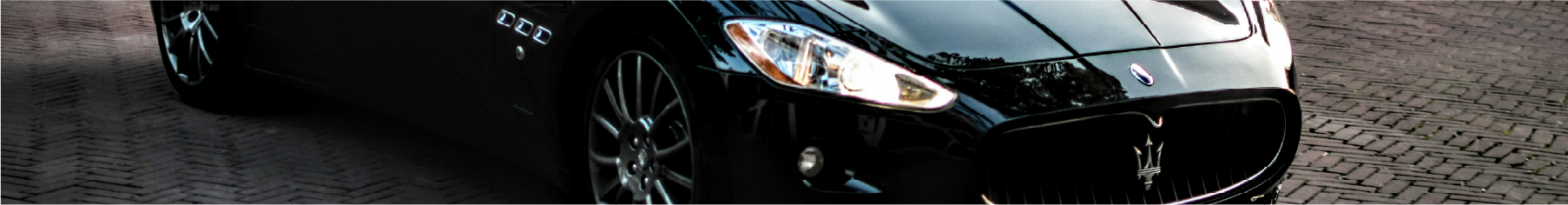 Cropped photo of a Jaguar on block paving after having Jaguar window tints installed