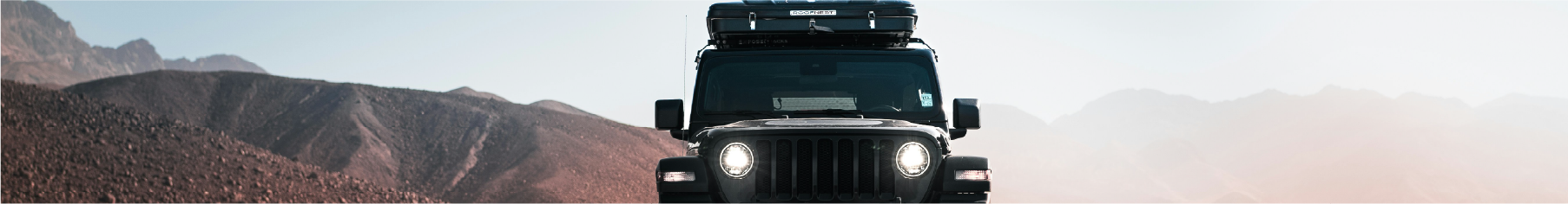 Jeep on rugges terrain with Jeep window tint installed