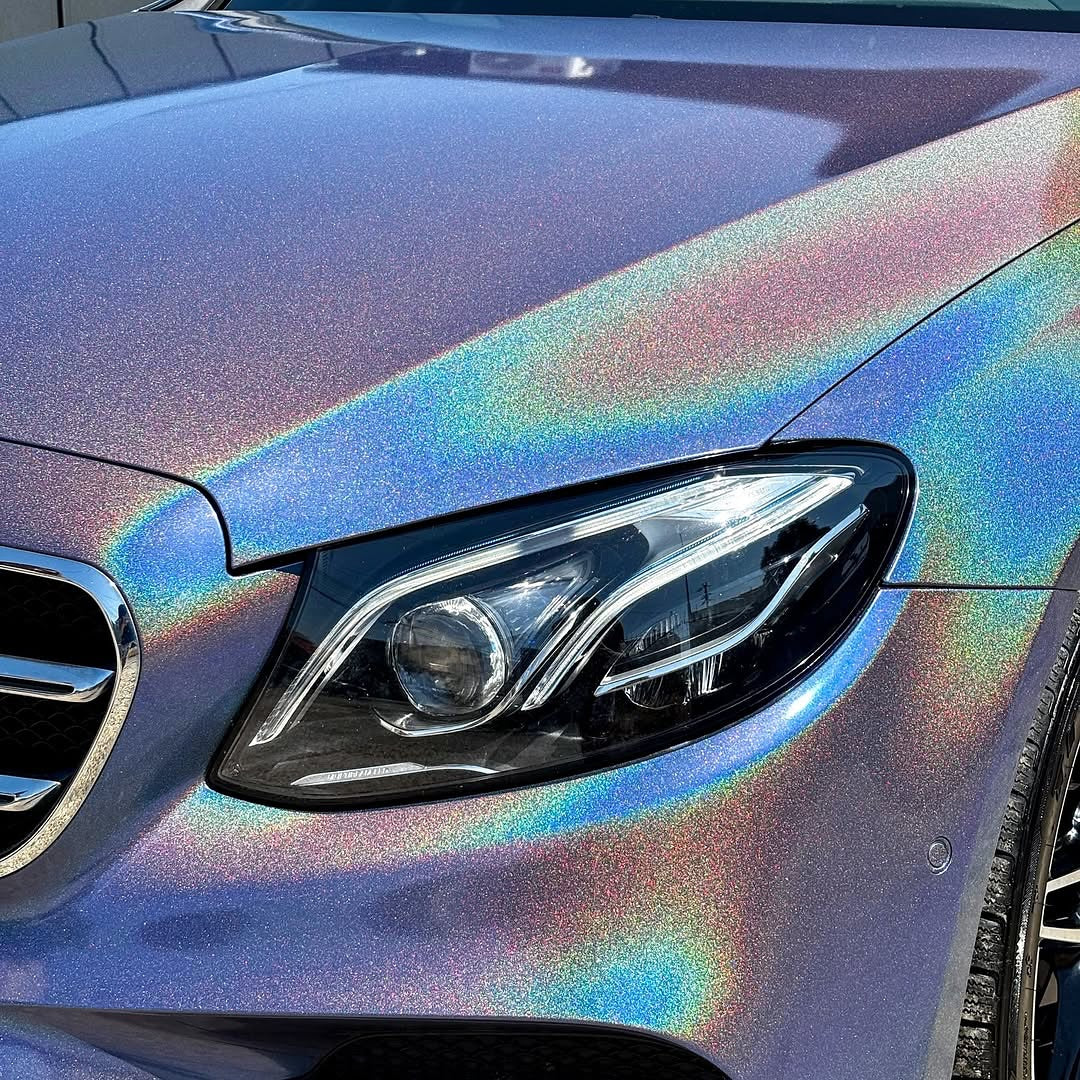 Oracal Gloss Intergalactic Blue on the hood with light hitting it